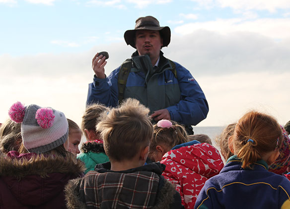 Picture of school children evening beach on a Dorset trip